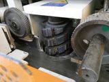 a picture of a machine that is working on a piece of machinery