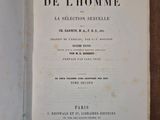 an old book opened to show the title of a novel
