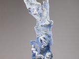 an image of a blue and white sculpture on a gray surface