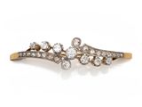 a pair of diamond and gold hair clips
