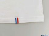 white t - shirt with red, white, and blue stripes on the front