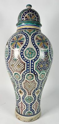 a large vase with a lid on a white background