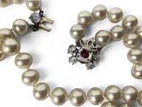pearl necklace with a cross pendant and a pearl necklace with a cross pendant