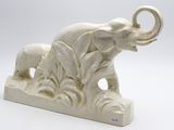 statue of an elephant with a baby elephant in the middle of it ' s body