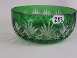 a green glass bowl that has a price tag on it