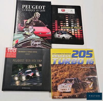 three books on a white table with a red car in the background