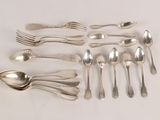 a lot of silver spoons and spoons on the table