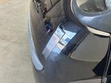 a close up of a car ' s bumper with a sticker on it