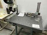 an image of a workbench with a microscope on it