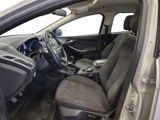 the interior of a car with the door open and the driver ' s seat down