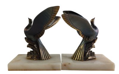 a pair of bookends made of metal and marble