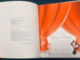 an open book with a picture of a teddy bear on it