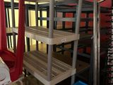 a room that has a bunch of shelves and chairs in it