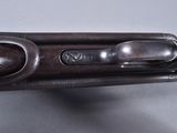 a close up of a gun that is on a table
