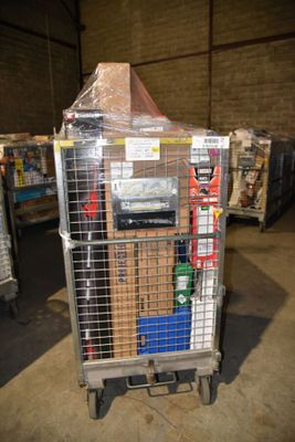 a cart with a lot of items in it in a warehouse