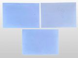 three pieces of blue paper with writing on them on a white surface