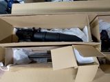 a box with a camera and a tripod inside of it