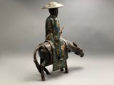 an image of a statue of a woman riding a horse