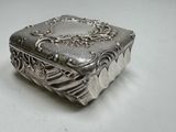 a silver box that is sitting on a table