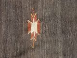 a close up of a rug with a design on it