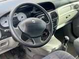 a steering wheel and dashboard of a small car