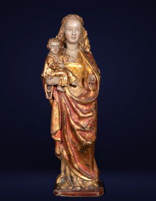 a statue of a woman holding a child in her arms