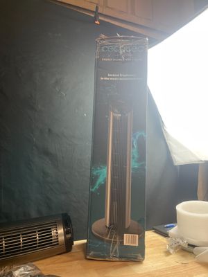 a box that is sitting on a table next to a fan