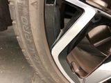 a close up of a car tire with a flat tire