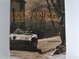 the book is open roads and front engines, with an image of a race car driving down a dirt road