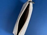 a small zipper bag on a blue background