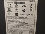 the back of a black refrigerator with a white label on it