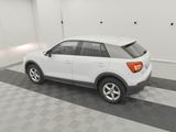 the white car is parked in the garage on the checkered floor