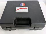 a black case with a sticker on it sitting on top of a table