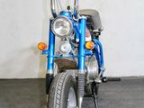 a blue motorcycle that is parked in a garage