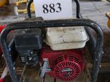a picture of a small engine on a pallet in a workshop