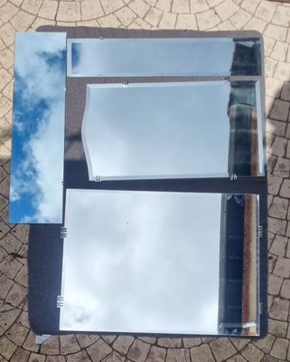TRAVAIL 1940 Suite de quatre miroirs à pattes d'accroche de …