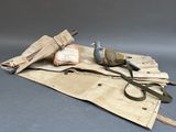 an old pair of scissors and a pair of scissors on a piece of cloth