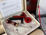 a box with a pen and a pipe in it