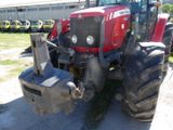 a tractor that is parked on the side of the road