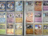 a lot of pokemon cards that are in a box