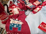 a shopping cart full of christmas items in a store