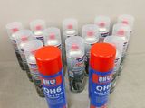 six cans of glue sitting on top of a table next to each other