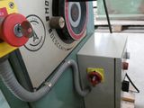 an image of a machine that is working on a piece of wood