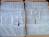 two boxes of cds are sitting on top of a table