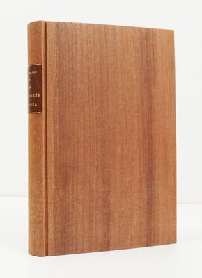 a wooden book sitting on top of a white surface