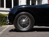 a black sports car parked in a parking lot