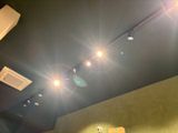 three lights that are on the ceiling above a sink