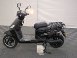 a scooter that is parked on a checkered floor