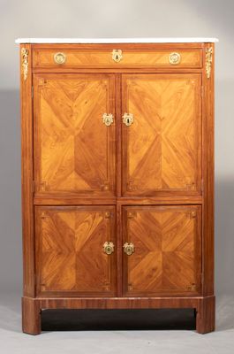 an antique wooden cabinet with marble top and two doors