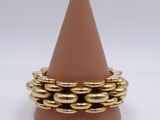 brown cone with gold rings sitting on top of it